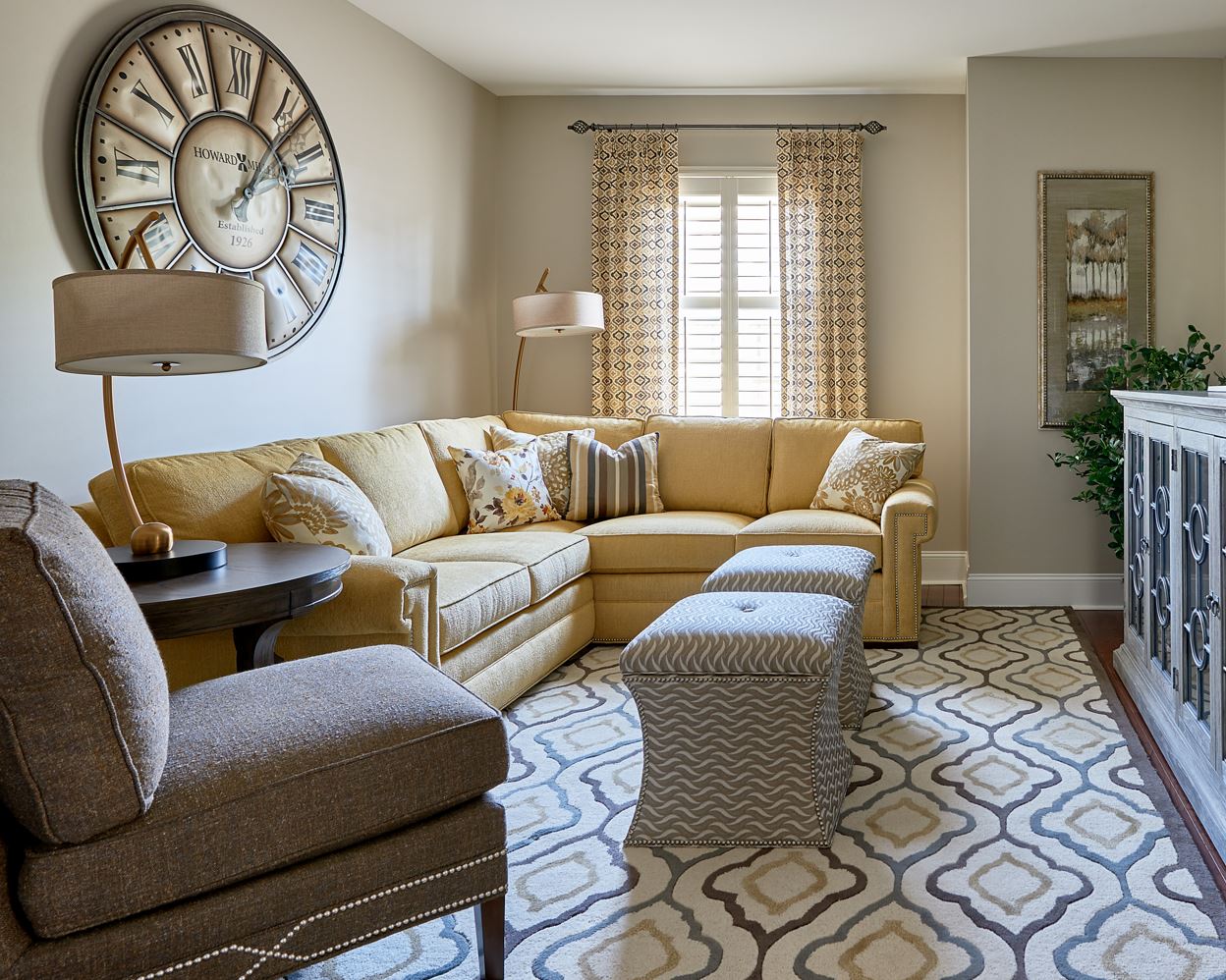 Versatile storage ottomans used in front of a sofa in place of a coffee table